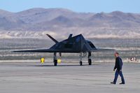 80-0787 @ KLSV - Lockheed / USAF / F-117A Nighthawk (cn A.4012) / Aviation Nation 2006 - Thunderbird crewmember in foreground.