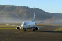 ZK-NGF @ DUD - Light early morning fog - by Micha Lueck