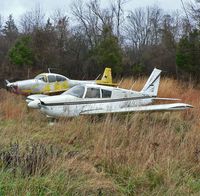 N4975L @ N51 - With a 1947 Navion A for company, this 1967 Piper Archer assumes its place in formation in Solberg's corrosion corner. - by Daniel L. Berek