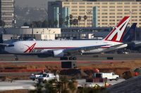 N744AX @ LAX - ABX Air N744AX (FLT ABX873) exitting RWY 25R after arrival from Fort Wayne Int'l (KFWA). - by Dean Heald