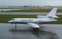 N850EP @ HOU - Taxis by the Air Terminal Museum in the rain - by Michael Bludworth