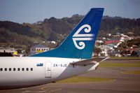 ZK-SJE @ WLG - The beautiful Air New Zealand koru tail - by Micha Lueck