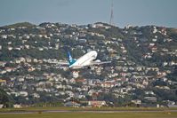 ZK-SJE @ WLG - Climbing out of Wellington - by Micha Lueck