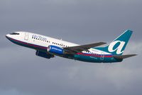 N268AT @ LAX - AirTran Airways N268AT (FLT TRS53) climbing out from RWY 25R enroute to Hartsfield Jackson Atlanta Int'l (KATL). The pilot is definitely looking towards me.