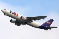 N724FD @ LAX - The sun was hiding behind some high clouds as FedEx N724FD (FLT FDX3068) climbs out from RWY 25R enroute to Rickenbacker Int'l (KLCK) - Columbus, Ohio.