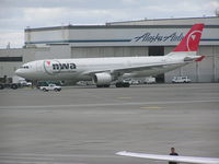 N854NW @ KSEA - Northwest A-330 under tow at Seatac - by John J. Boling