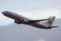 N971AN @ LAX - American Airlines N971AN (FLT AAL2452) climbing out from RWY 25R on a cold, stormy afternoon enroute to Dallas Fort Worth Int'l (KDFW). - by Dean Heald