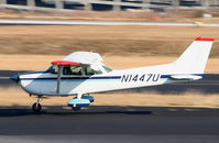 N1447U @ PDK - Bouncing into a landing - by Michael Martin