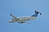 ZK-EAE @ WLG - Climbing out of Wellington - by Micha Lueck