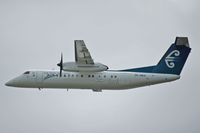 ZK-NED @ WLG - Climbing out of Wellington - by Micha Lueck