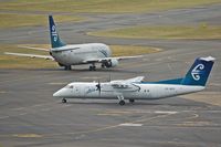 ZK-NED @ WLG - Dash 8Q300 (ZK-NED) follows B 737-300 (ZK-NGF) to the runway - by Micha Lueck