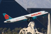 N624AW @ LAS - America West N624AW (FLT AWE190) climbing out from 01R enroute to Seattle Tacoma Int'l (KSEA).