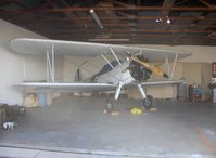 N1702B @ SZP - 1942 Boeing PT-13D 'Ruthie's Doll', Continental W670 220 Hp, in hangar - by Doug Robertson