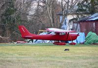 N2466J @ N75 - Almost blending in with the main airport building was this hot little 1966 Cessna 150. - by Daniel L. Berek