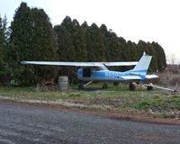 N8990S @ N75 - Parked in a driveway just off a side not far from Twin Pine's main turf runway was this 1965 Cessna 150 that had definitely seen better days. - by Daniel L. Berek