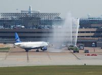 N618JB @ HOU - Water cannon salute as she approaches the gate. - by Michael Bludworth