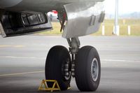 ZK-KFS @ AKL - The left main landing gear of Convair ZK-KFS - by Micha Lueck