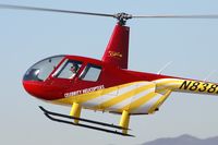 N838DD @ SMO - Close-up of Celebrity Helicopter's 2000 Robinson R44 N838DD, piloted by an attractive young lady, coming in for a landing at the helipad at Santa Monica Municipal Airport.