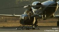 N195CP @ ISO - Cast in the golden sunset, resting on a tow trolley