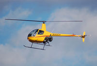 N302CH @ KASH - R22 flyting down runway 32 to land at the ramp - by Nick Michaud