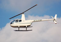 N7530M @ KASH - R44 flying down 32 - by Nick Michaud
