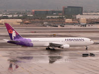 N594HA @ KPHX - Taxiing for runway 7L on a cold and wet January day in normally sunny Phoenix