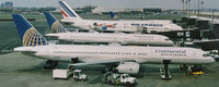 N14107 @ EWR - A Continental 757-224 joins other interesting aircraft at Newark's Terminal C in 1999. - by Daniel L. Berek