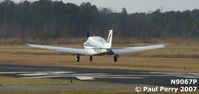 N9067P @ PVG - Touching down, nearly on the numbers - by Paul Perry