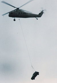 N901CH @ YIP - Sikorsky S-58 lifting a little car before dropping it at Airshow - by Florida Metal