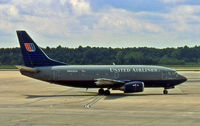 N955UA @ CLT - Sweet United 737-500 taxies to its parking space at Charlotte. - by Daniel L. Berek
