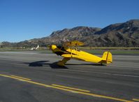 N1017U @ SZP - 1939 Bucker Jungmann C.A.S.A. 1.131, Lycoming O-360 180 Hp upgrade, owner/pilot 'posing' aircraft for photographer by stopping taxi. Thank You, Pat! - by Doug Robertson