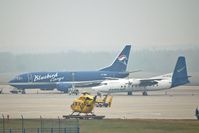 TF-BBE @ CGN - B 737 of Bluebird Cargo, Fokker 27 of Farnair, and a rescue helicopter of the ADAC - by Micha Lueck