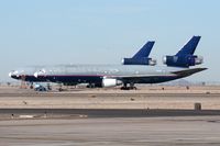 N323FE @ GYR - United Airlines N323FE (once UAL Worldwide Cargo, and most recently leased to FedEx) DC-10-30(F) stored at Goodyear Airport (KGYR).  When the lease expired in 2006, this aircraft was returned to UAL and stored here. - by Dean Heald