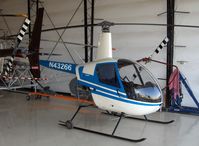N43266 @ CMA - 1990 Robinson R22 BETA, Lycoming O-320-BC, in Orbic's spotless deluxe hangar - by Doug Robertson