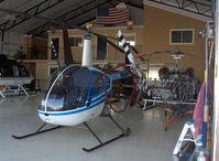 N43266 @ CMA - 1990 Robinson R22 BETA, Lycoming O-320-BC, in Orbic's spotless deluxe hangar - by Doug Robertson