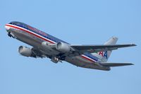 N329AA @ LAX - Condensation briefly appears at the engine faces of American Airlines N329AA (FLT AAL22) as she climbs out from RWY 25R enroute to John F Kennedy Int'l (KJFK). - by Dean Heald