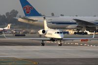 N7WG @ LAX - Hawker Air LP's 1979 Gulfstream G-IISP crossing RWY 25L on taxiway ST after arrival.