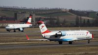 OE-LCG @ VIE - Austrian  CRY-200LR taxiing to the RWY 34 - by Dieter Klammer