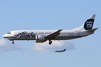 N713AS @ LAX - Alaska Airlines N713AS (FLT ASA243) from Playa De Oro Int'l (MMZO) - Manzanillo, Mexico on short final to RWY 25R. The Skywest Brasilia is on approach to RWY 24R.