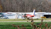 N5629R @ 12N - Nice 1965 Cessna Skyhawk, as seen through the woods at Aerflex Andover. - by Daniel L. Berek