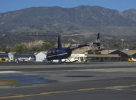 N4466 @ SZP - 2004 Robinson R44 CLIPPER II  w/pop-out floats, Lycoming IO-540 260 hp derated to 225 Hp for takeoff, 205 hp continuous, crossing Rwy 22 to refuel - by Doug Robertson