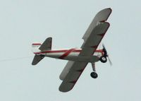 N59754 - Some 47 years after she was built, this Stearman was still plying her trade as a banner tow plane. - by Daniel L. Berek