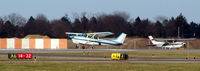 N4975G @ FRG - Skyhawk waiting behind a departing skyhawk... - by Stephen Amiaga