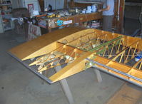 N66711 @ SZP - 1941 Boeing Stearman IB75A, Jacobs R-755, in rebuild, lower right wing just varnished-other three completed - by Doug Robertson