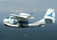 N217G - N217G with the Olympic Mountains in Washington - by Tom Hoag