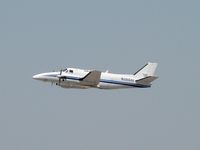N388AV @ PHX - Departing PHX at lunchtime - by John Meneely