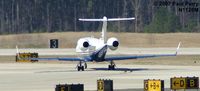 N1125M @ RDU - Lear making her way to the runway - by Paul Perry