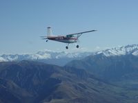 ZK-JCW - ZK-JCW cruising in the Southern Alps of NZ - by Harry Gallagher