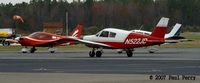 N522JD @ SFQ - Taxiing by some familiar looking tails - by Paul Perry