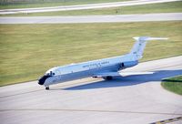 68-10961 @ CID - C-9A taxiing in by the control tower (scratch on slide)